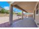 Covered patio and backyard featuring gravel landscaping, providing a low-maintenance outdoor space at 152 Walkinshaw Ave, Las Vegas, NV 89148