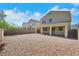 Expansive backyard with a covered patio and gravel landscaping, perfect for outdoor living and entertaining at 152 Walkinshaw Ave, Las Vegas, NV 89148