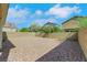 Expansive backyard with gravel landscaping and a brick privacy fence, perfect for low-maintenance outdoor enjoyment at 152 Walkinshaw Ave, Las Vegas, NV 89148