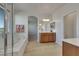 Bright bathroom boasting a tub, glass shower, and double vanity, creating a spa-like retreat at 152 Walkinshaw Ave, Las Vegas, NV 89148