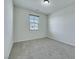 Bedroom featuring neutral walls, carpet, and window that provide natural light at 152 Walkinshaw Ave, Las Vegas, NV 89148