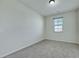 Neutrally decorated bedroom with gray carpet and a window that provide natural light at 152 Walkinshaw Ave, Las Vegas, NV 89148