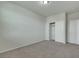 Neutrally decorated bedroom with gray carpet and closet with access for storage at 152 Walkinshaw Ave, Las Vegas, NV 89148