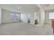 Expansive bonus room with plush carpeting, natural light, and access to a bathroom at 152 Walkinshaw Ave, Las Vegas, NV 89148