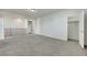 Spacious bonus room with plush carpeting, showcasing versatile living space at 152 Walkinshaw Ave, Las Vegas, NV 89148