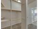 Walk-in closet offering custom shelving, providing ample storage, and easy organization solutions at 152 Walkinshaw Ave, Las Vegas, NV 89148