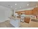 Well-lit kitchen featuring recessed lights, an island, tile flooring, and modern appliances at 152 Walkinshaw Ave, Las Vegas, NV 89148