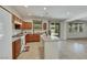 Kitchen with an island, tile flooring, modern appliances, and a view of the backyard at 152 Walkinshaw Ave, Las Vegas, NV 89148