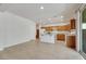 Well-lit kitchen with an island, stainless steel appliances, and ample cabinet space at 152 Walkinshaw Ave, Las Vegas, NV 89148