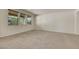 Inviting living room with three windows offering plenty of natural light at 152 Walkinshaw Ave, Las Vegas, NV 89148