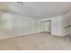 Bright living room featuring neutral carpet and an open layout at 152 Walkinshaw Ave, Las Vegas, NV 89148