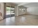 Bright open living space with tile and carpet floors and sliding glass door at 152 Walkinshaw Ave, Las Vegas, NV 89148