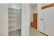 Spacious walk-in pantry with shelving and a modern refrigerator at 152 Walkinshaw Ave, Las Vegas, NV 89148