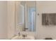 Bathroom featuring a vanity, large mirror, and a towel rack with soft, neutral colored towels at 1611 Prairie Fields Ct, Las Vegas, NV 89115