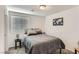 Comfortable bedroom featuring a bed, window, bedside table and carpeted floors at 1611 Prairie Fields Ct, Las Vegas, NV 89115