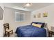 This cozy bedroom features a comfortable bed with a blue duvet, creating a relaxing retreat at 1611 Prairie Fields Ct, Las Vegas, NV 89115