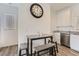 Dining area with table and bench seating adjacent to the modern kitchen at 1611 Prairie Fields Ct, Las Vegas, NV 89115
