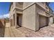 Charming two-story home featuring a brick driveway and stucco exterior at 1611 Prairie Fields Ct, Las Vegas, NV 89115
