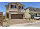 Inviting two-story home with a spacious two-car garage and desert landscaping at 1611 Prairie Fields Ct, Las Vegas, NV 89115
