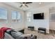 Well-lit living room with plush carpet and multiple windows at 1611 Prairie Fields Ct, Las Vegas, NV 89115