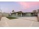 Picture of a well maintained backyard with green grass and a large concrete patio, perfect for entertaining at 1628 Izabella Ave, Las Vegas, NV 89169