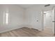 Bright bedroom with neutral walls, wood flooring, and white trim at 1628 Izabella Ave, Las Vegas, NV 89169
