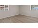 Bedroom featuring light-colored walls, wood-look flooring, and white trim at 1628 Izabella Ave, Las Vegas, NV 89169