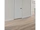 Bright, airy bedroom with white walls, white trim, and sleek wood flooring at 1628 Izabella Ave, Las Vegas, NV 89169