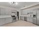 Modern kitchen with gray cabinets, stainless steel appliances, and wood flooring at 1628 Izabella Ave, Las Vegas, NV 89169