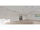 Bright, open-concept living room with wood floors, recessed lighting, and seamlessly connects to the kitchen at 1628 Izabella Ave, Las Vegas, NV 89169