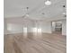 Spacious living room with high vaulted ceilings, modern lighting, and wood flooring at 1628 Izabella Ave, Las Vegas, NV 89169