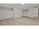 This main bedroom offers walk-in closets, white walls, and wood floors at 1628 Izabella Ave, Las Vegas, NV 89169