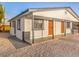 Charming exterior with a covered entry, metal security doors and low-maintenance desert landscaping at 1820 Yale St, North Las Vegas, NV 89030