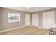 Bright living room featuring wood floors, window and ample closet space, perfect for relaxation and storage at 1820 Yale St, North Las Vegas, NV 89030