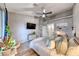 Bright bedroom with wood-look floors, vaulted ceilings, stylish decor, and access to the ensuite bathroom at 200 Teller St, Henderson, NV 89074