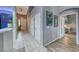 Open hallway featuring gray walls, contrasting trim, and access to multiple rooms at 200 Teller St, Henderson, NV 89074