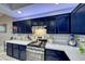 Modern kitchen features white quartz countertops and stainless steel appliances at 200 Teller St, Henderson, NV 89074