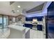 Stylish kitchen with blue cabinetry, stainless steel appliances, and breakfast bar at 200 Teller St, Henderson, NV 89074