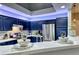 Well-lit kitchen boasts stainless steel appliances and blue cabinets at 200 Teller St, Henderson, NV 89074