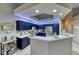 Bright kitchen boasts blue cabinets, white quartz countertops, and modern lighting at 200 Teller St, Henderson, NV 89074