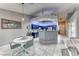Bright eat-in kitchen features blue cabinets, quartz countertops, and stainless steel appliances at 200 Teller St, Henderson, NV 89074