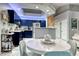 Well-equipped kitchen with blue cabinets, quartz countertops, and stainless steel appliances at 200 Teller St, Henderson, NV 89074