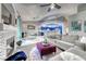 Open concept living room with backyard access, stylish decor, and a view of the kitchen at 200 Teller St, Henderson, NV 89074