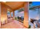 View of covered patio with seating area, dining area, built-in grill, and ample space for entertaining at 200 Teller St, Henderson, NV 89074