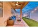 Relaxing covered patio area with comfortable seating, hanging chairs, and an artificial turf at 200 Teller St, Henderson, NV 89074