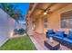 Inviting covered patio with comfortable seating, ceiling fan, and views of the well-maintained outdoor area at 200 Teller St, Henderson, NV 89074