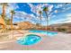 Sparkling community pool and spa surrounded by palm trees and lounge chairs create a resort-like atmosphere for relaxation at 200 Teller St, Henderson, NV 89074