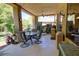 Spacious covered back patio with a ceiling fan and plenty of room for seating and entertaining at 2026 Poppywood Ave, Henderson, NV 89012