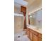 Bright bathroom features a large mirror, shower-tub combo, and ample counter space at 2026 Poppywood Ave, Henderson, NV 89012