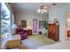 Spacious bedroom featuring a large window, a purple door, and an armoire at 2026 Poppywood Ave, Henderson, NV 89012